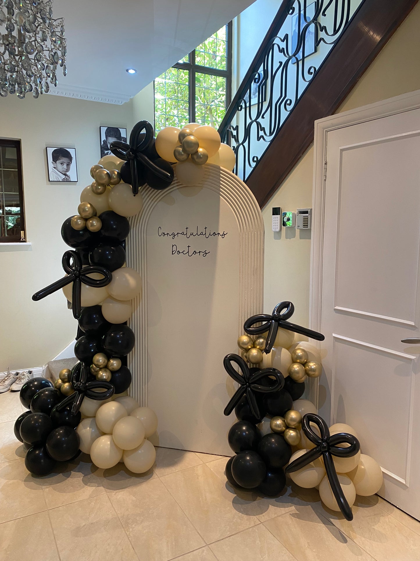 Beautiful black & sand white arch with bows