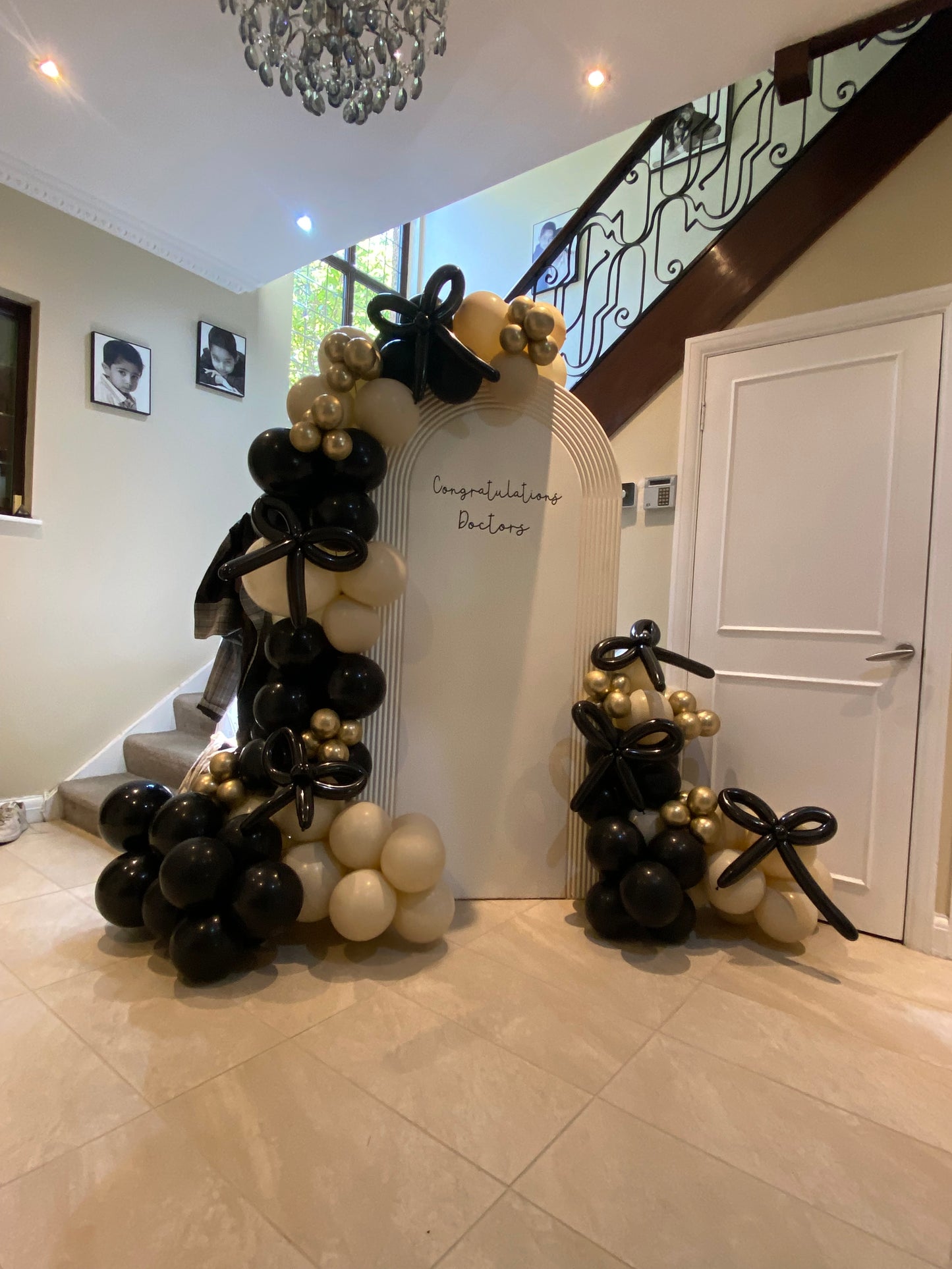 Beautiful black & sand white arch with bows