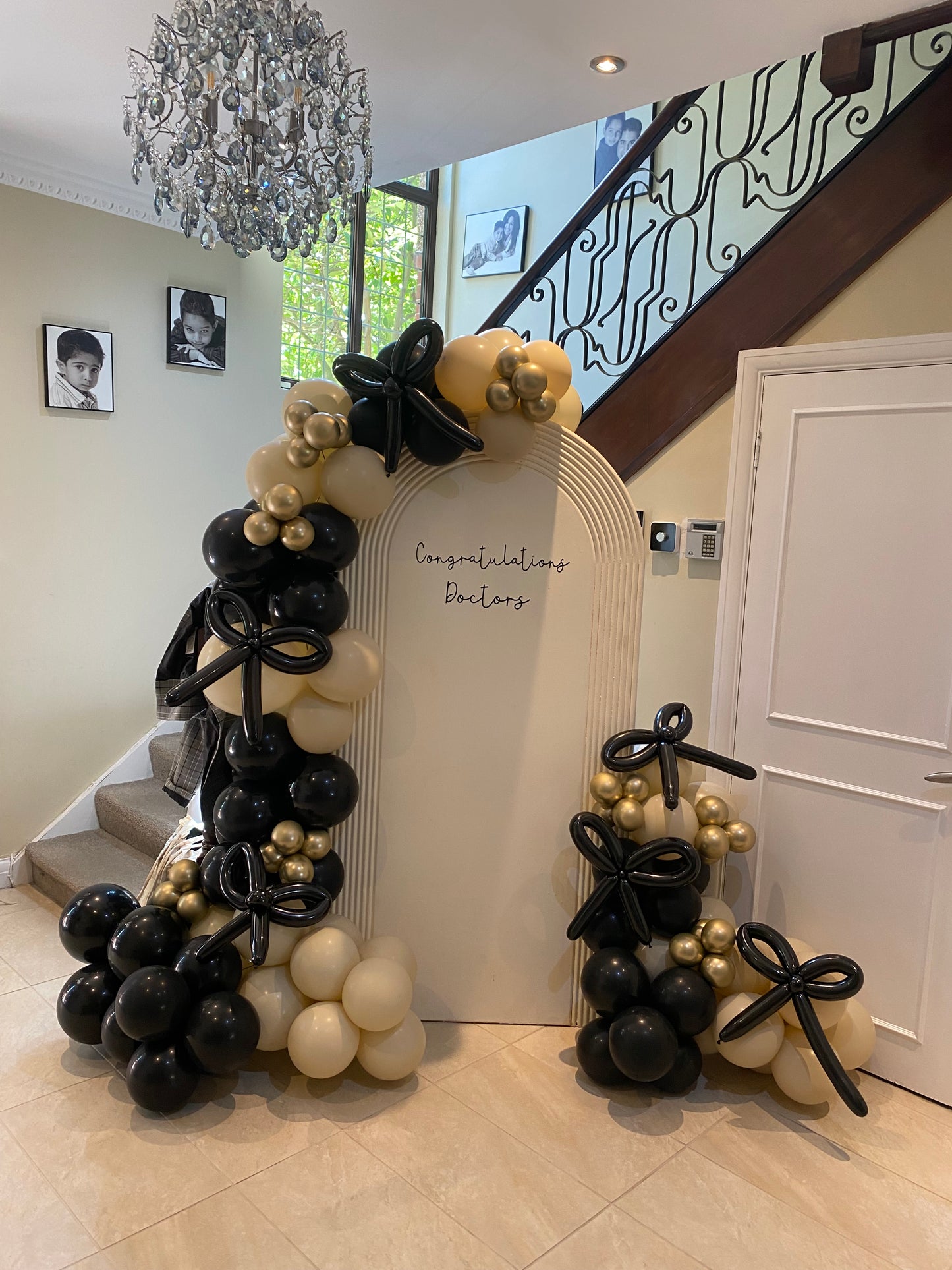 Beautiful black & sand white arch with bows